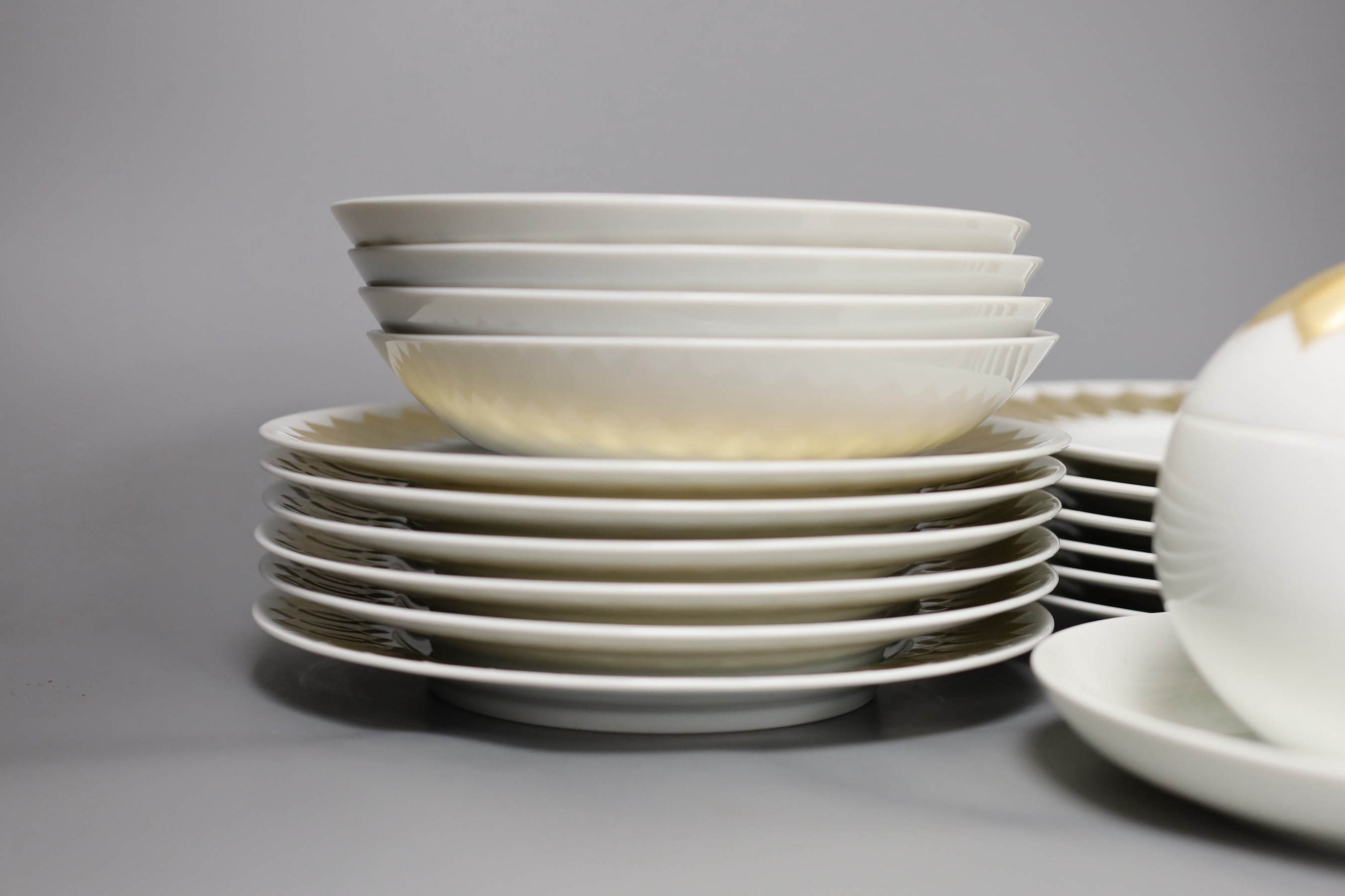A Rosenthal Studio Line white and gold lotus pattern part dinner service